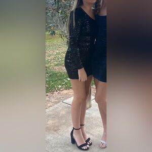 Windsor dress size small black sequins.  Feather on one shoulder.